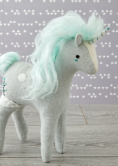 green unicorn toy crate and barrel